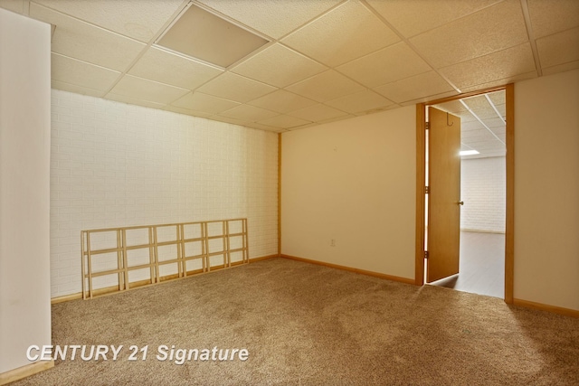 3803 Prairie Creek St, Saginaw, MI 48603 - spare room featuring a drop ceiling, carpet, and baseboards