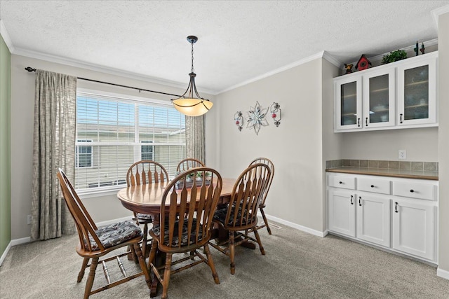 11855 Cedarbrook Dr, South Lyon, MI 48178 - dining room with crown molding, baseboards, a textured ceiling, and light colored carpet