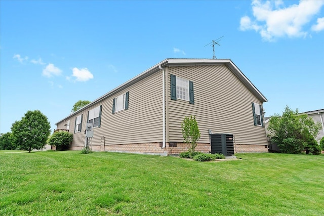 11855 Cedarbrook Dr, South Lyon, MI 48178 - view of property exterior featuring a yard and central air condition unit
