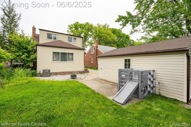 1395 Aline Dr, Grosse Pointe Woods, MI 48236 - rear view of house with a lawn, central air condition unit, a chimney, and a shingled roof