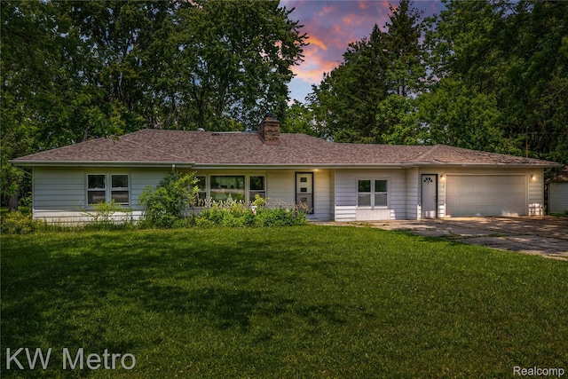 3191 Perry Ct, Grand Blanc, MI 48439 - single story home featuring an attached garage, driveway, a chimney, and a lawn