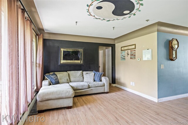 3191 Perry Ct, Grand Blanc, MI 48439 - living area featuring light wood finished floors and baseboards