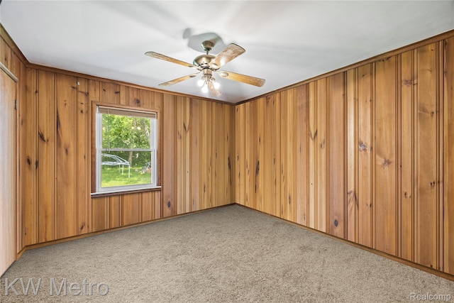 3191 Perry Ct, Grand Blanc, MI 48439 - carpeted spare room featuring ceiling fan and wooden walls