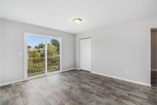 13670 Oasis Ave, Holland, MI 49424 - empty room with wood finished floors and baseboards
