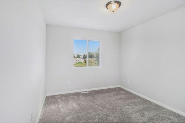 13670 Oasis Ave, Holland, MI 49424 - carpeted empty room featuring baseboards