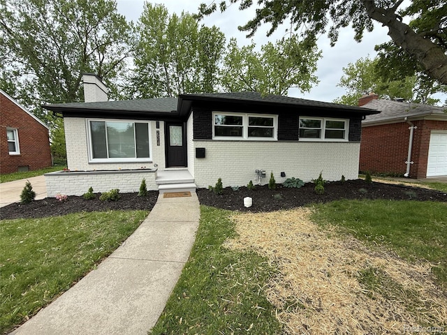 20218 Chalon St, Saint Clair Shores, MI 48080 - ranch-style home featuring brick siding, a chimney, and a front yard