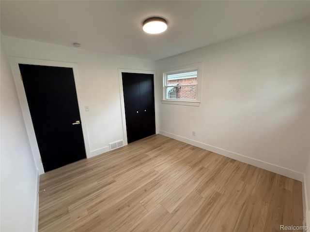 20218 Chalon St, Saint Clair Shores, MI 48080 - unfurnished bedroom featuring light wood-type flooring, baseboards, and a closet