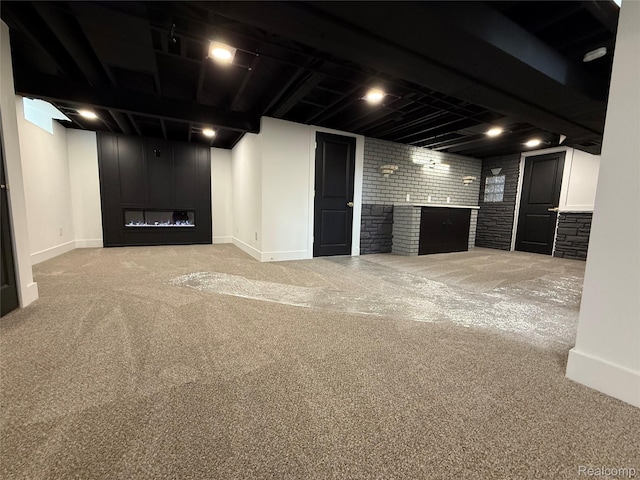 20218 Chalon St, Saint Clair Shores, MI 48080 - finished below grade area with a large fireplace, carpet flooring, baseboards, and brick wall