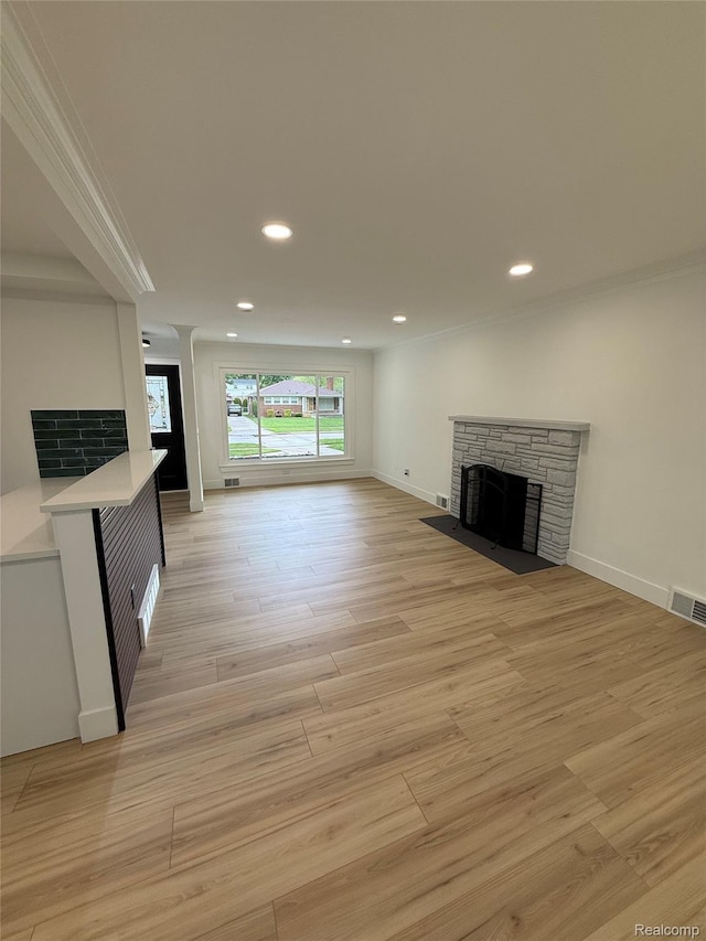 20218 Chalon St, Saint Clair Shores, MI 48080 - unfurnished living room with a fireplace, recessed lighting, light wood-style flooring, ornamental molding, and baseboards
