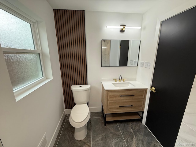 20218 Chalon St, Saint Clair Shores, MI 48080 - half bathroom featuring toilet, vanity, baseboards, and marble look tile flooring