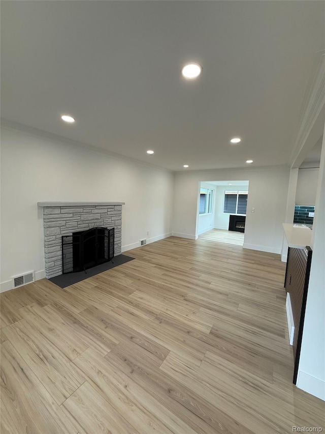 20218 Chalon St, Saint Clair Shores, MI 48080 - unfurnished living room featuring a stone fireplace, light wood finished floors, recessed lighting, and baseboards