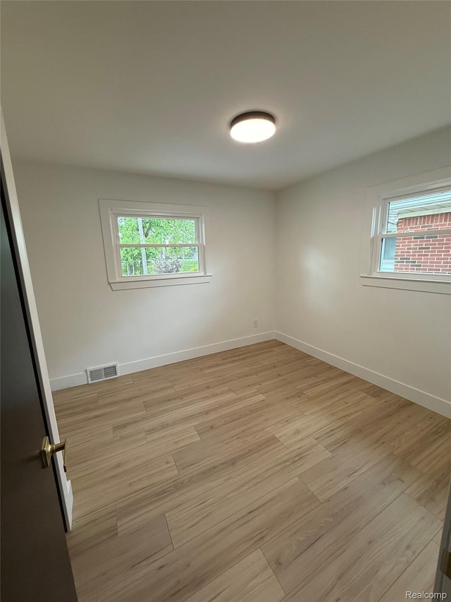 20218 Chalon St, Saint Clair Shores, MI 48080 - unfurnished room featuring light wood-style flooring, plenty of natural light, and baseboards