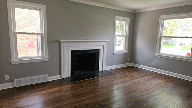 15465 Murray Hl, Detroit, MI 48227 - unfurnished living room with dark wood-style flooring, a fireplace with raised hearth, and baseboards
