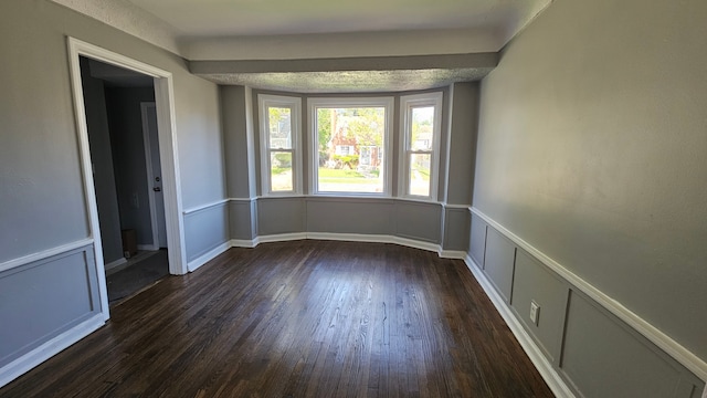 15465 Murray Hl, Detroit, MI 48227 - spare room featuring dark wood-type flooring and a decorative wall