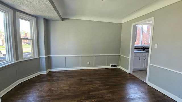 15465 Murray Hl, Detroit, MI 48227 - spare room with dark wood-type flooring and a sink