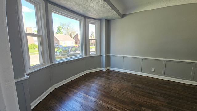 15465 Murray Hl, Detroit, MI 48227 - empty room with dark wood finished floors, a decorative wall, and a wainscoted wall