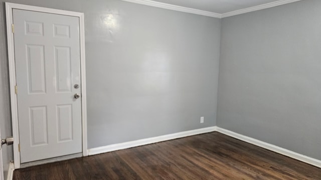 15465 Murray Hl, Detroit, MI 48227 - unfurnished room featuring dark wood-type flooring, ornamental molding, and baseboards