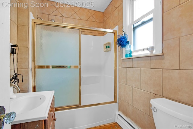 2393 Burger St, Hamtramck, MI 48212 - bathroom with vanity, shower / bath combination with glass door, toilet, tile walls, and baseboard heating