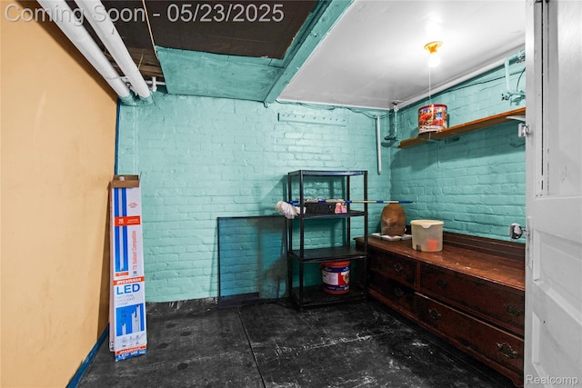 2393 Burger St, Hamtramck, MI 48212 - miscellaneous room featuring baseboards and brick wall