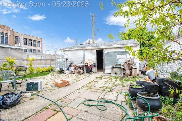2393 Burger St, Hamtramck, MI 48212 - view of patio / terrace with ac unit and an outbuilding
