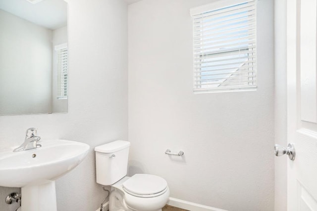 637 Manorwood Cir, Benton Harbor, MI 49022 - half bath featuring toilet, plenty of natural light, and a sink