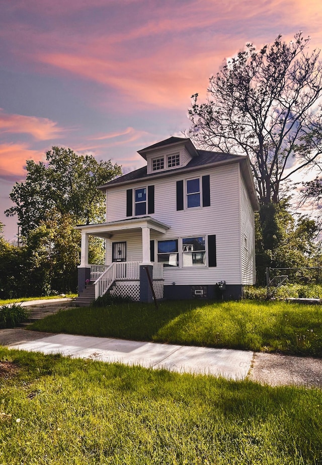 2927 Seyburn St, Detroit, MI 48214 - traditional style home featuring a porch and a lawn