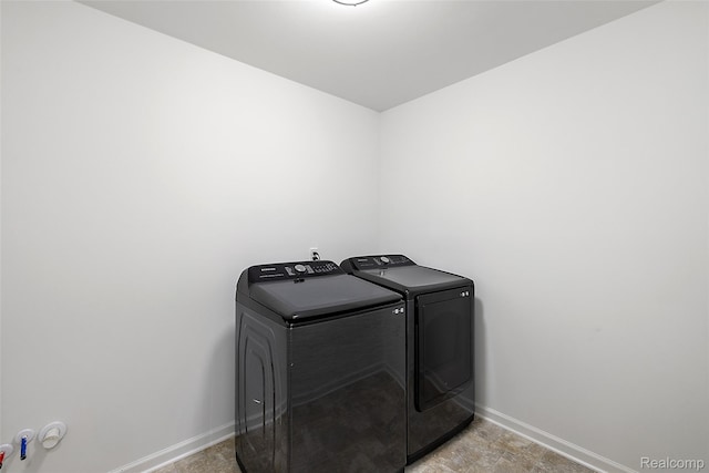 24603 Beach Dr, Macomb, MI 48042 - laundry room featuring washing machine and clothes dryer and baseboards