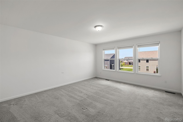 24603 Beach Dr, Macomb, MI 48042 - carpeted empty room with baseboards