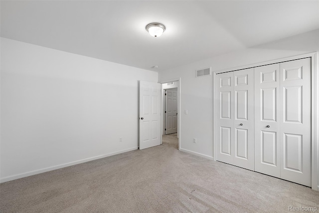 24603 Beach Dr, Macomb, MI 48042 - unfurnished bedroom with light carpet, baseboards, and a closet