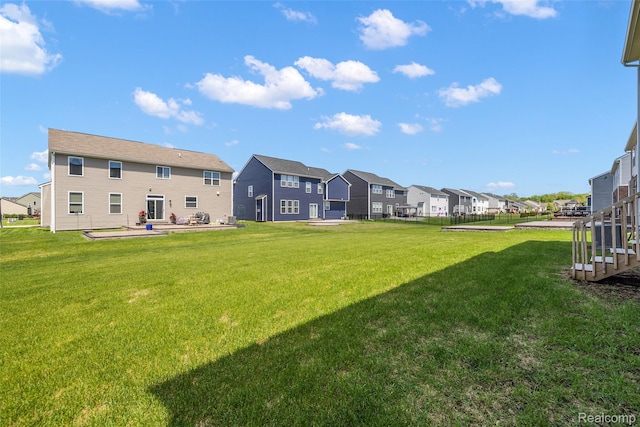 24603 Beach Dr, Macomb, MI 48042 - view of green lawn featuring a residential view and a patio area