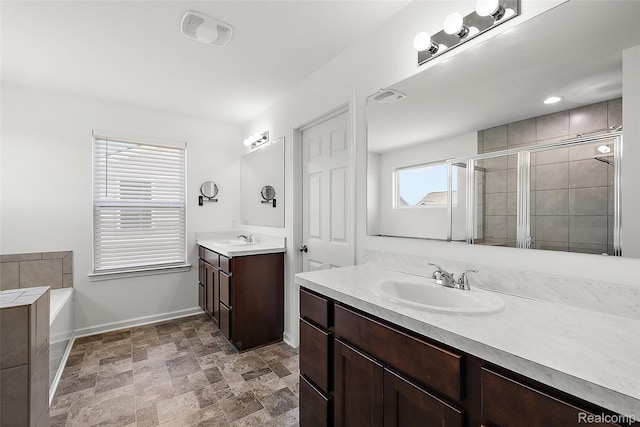 24603 Beach Dr, Macomb, MI 48042 - full bath with two vanities, a stall shower, a bath, baseboards, and stone finish flooring