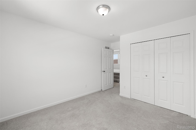 24603 Beach Dr, Macomb, MI 48042 - unfurnished bedroom featuring carpet floors, baseboards, and a closet