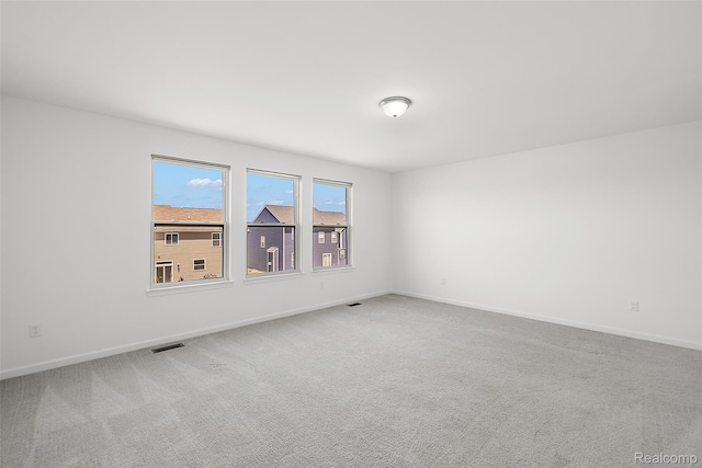 24603 Beach Dr, Macomb, MI 48042 - carpeted empty room with baseboards