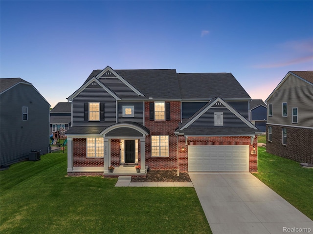24603 Beach Dr, Macomb, MI 48042 - view of front of home featuring brick siding, a front yard, concrete driveway, and an attached garage