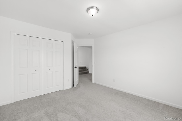 24603 Beach Dr, Macomb, MI 48042 - unfurnished bedroom with carpet flooring, a closet, and baseboards