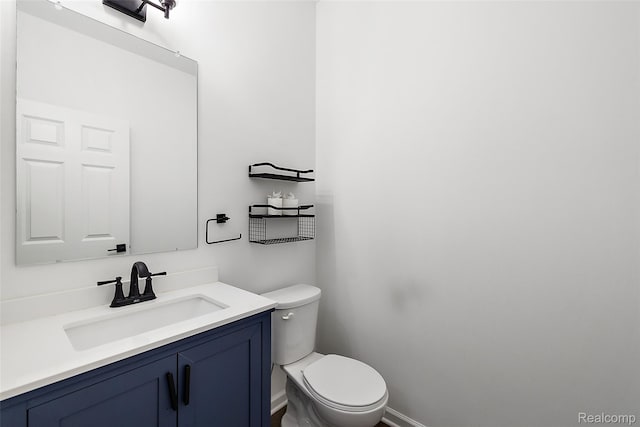 24603 Beach Dr, Macomb, MI 48042 - bathroom with toilet, vanity, and baseboards