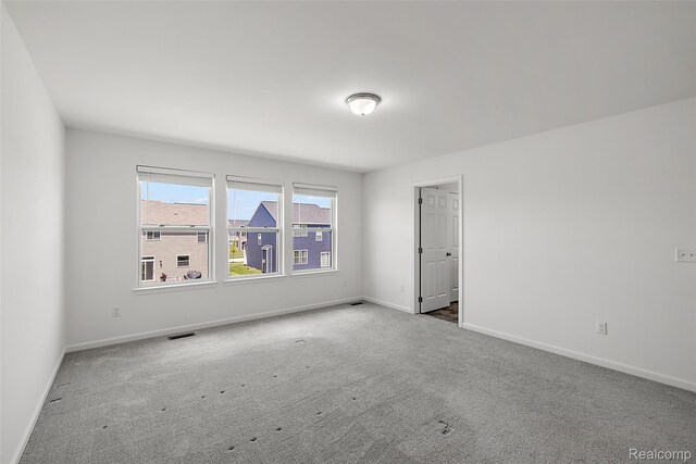 24603 Beach Dr, Macomb, MI 48042 - carpeted spare room with baseboards