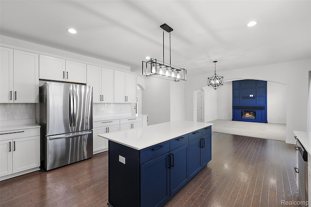 24603 Beach Dr, Macomb, MI 48042 - kitchen featuring stainless steel appliances, backsplash, dark wood-style floors, recessed lighting, and light countertops