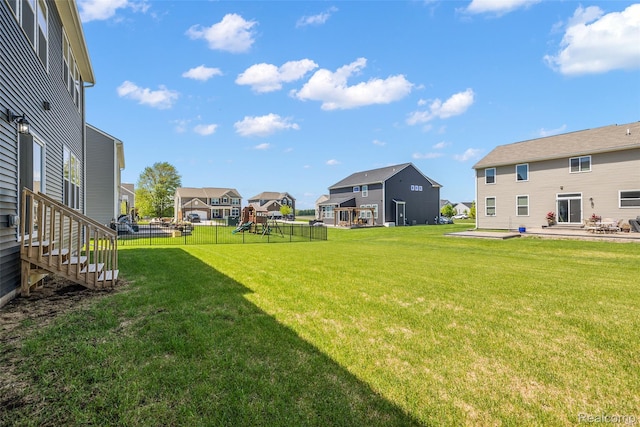 24603 Beach Dr, Macomb, MI 48042 - view of yard with a residential view, a playground, and a patio