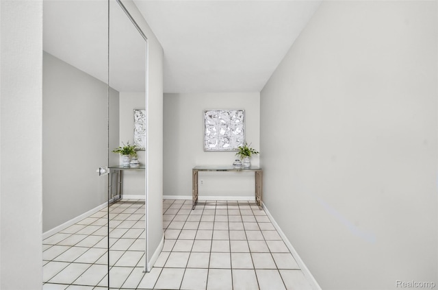 3553 Port Cove Dr Unit 39, Waterford, MI 48328 - hallway with light tile patterned floors and baseboards