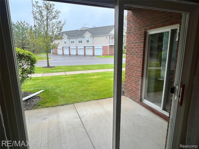 46117 Rhodes Dr Unit 298, Macomb, MI 48044 - entryway featuring brick wall and a residential view