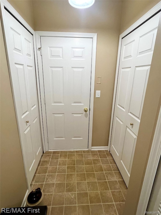 46117 Rhodes Dr Unit 298, Macomb, MI 48044 - doorway to outside with baseboards