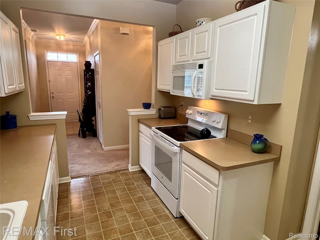 46117 Rhodes Dr Unit 298, Macomb, MI 48044 - kitchen featuring white appliances, white cabinetry, light countertops, baseboards, and carpet
