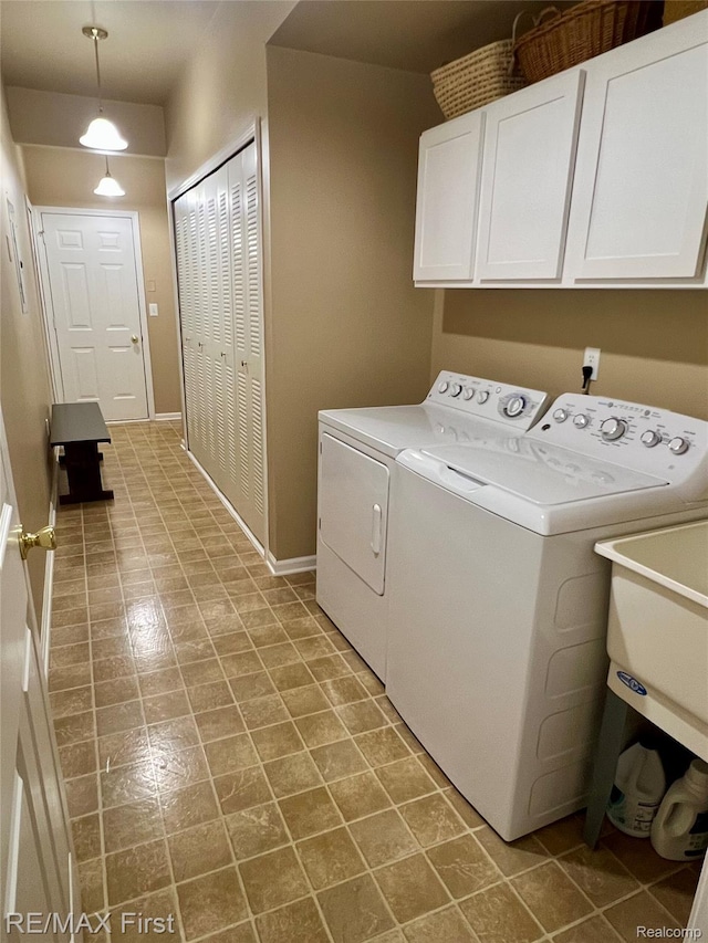 46117 Rhodes Dr Unit 298, Macomb, MI 48044 - washroom with washer and dryer, cabinet space, and baseboards