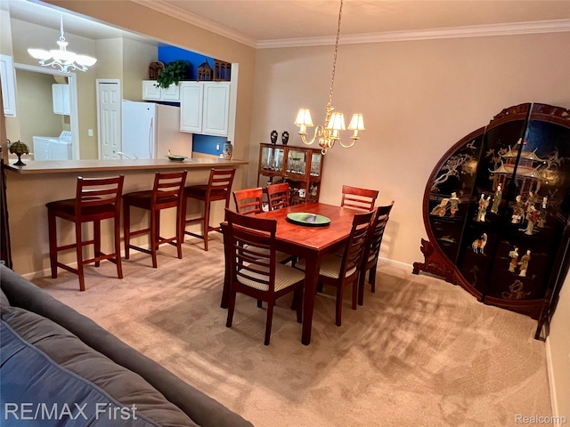 46117 Rhodes Dr Unit 298, Macomb, MI 48044 - dining area with a chandelier, independent washer and dryer, light colored carpet, and crown molding