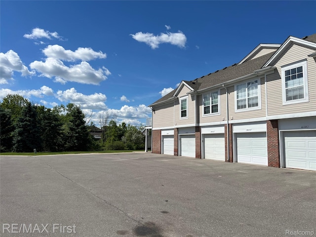 46117 Rhodes Dr Unit 298, Macomb, MI 48044 - view of side of home featuring brick siding