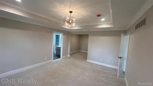 206 E Windemere Ave, Royal Oak, MI 48073 - spare room with a raised ceiling, a chandelier, baseboards, light colored carpet, and crown molding