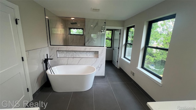 206 E Windemere Ave, Royal Oak, MI 48073 - full bath with a marble finish shower, a freestanding tub, and tile patterned floors