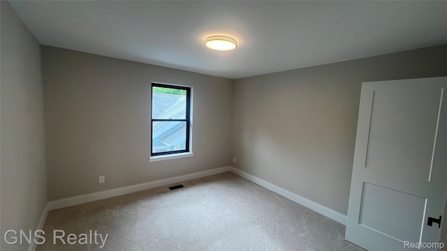 206 E Windemere Ave, Royal Oak, MI 48073 - carpeted empty room featuring baseboards