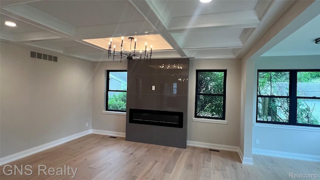 206 E Windemere Ave, Royal Oak, MI 48073 - unfurnished living room with coffered ceiling, a chandelier, wood finished floors, plenty of natural light, and baseboards